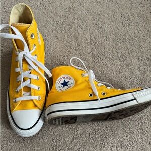 Yellow converse high tops